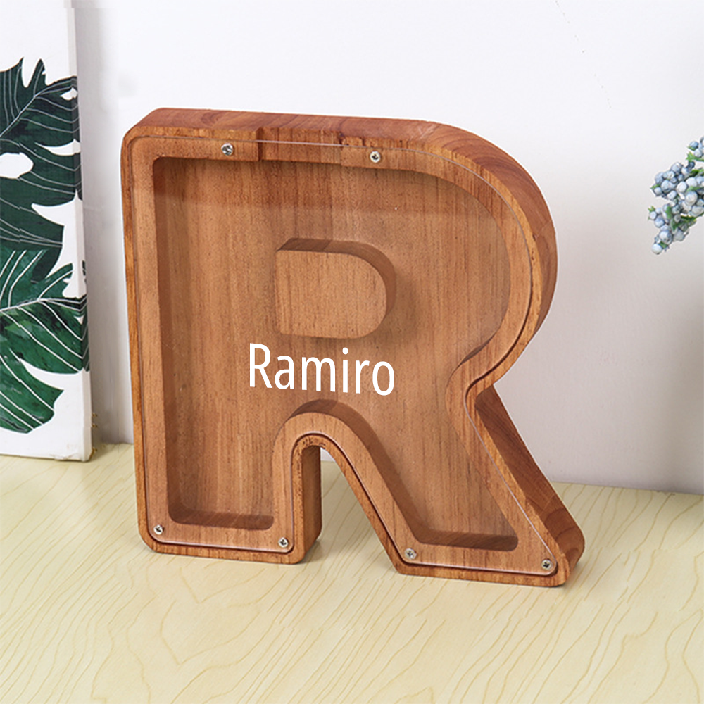 MadeMine letter R personalised wooden piggy bank in natural wood finish with Ramiro name display