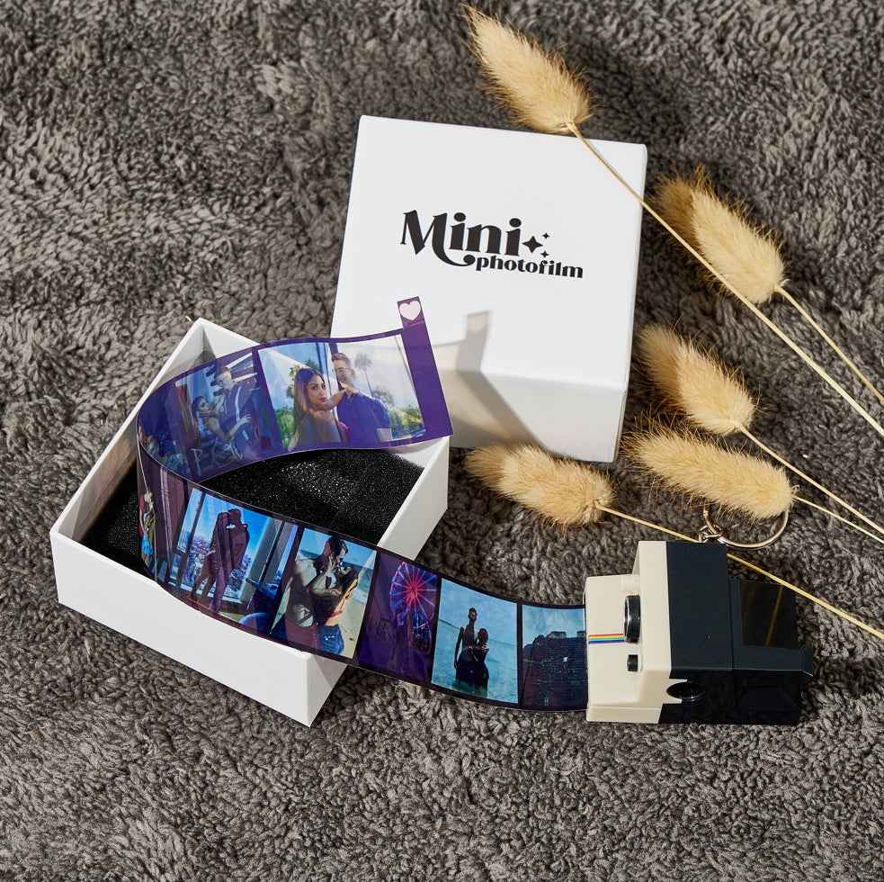 MadeMine custom camera keychain with mini photofilm and personalized photo strip in white box