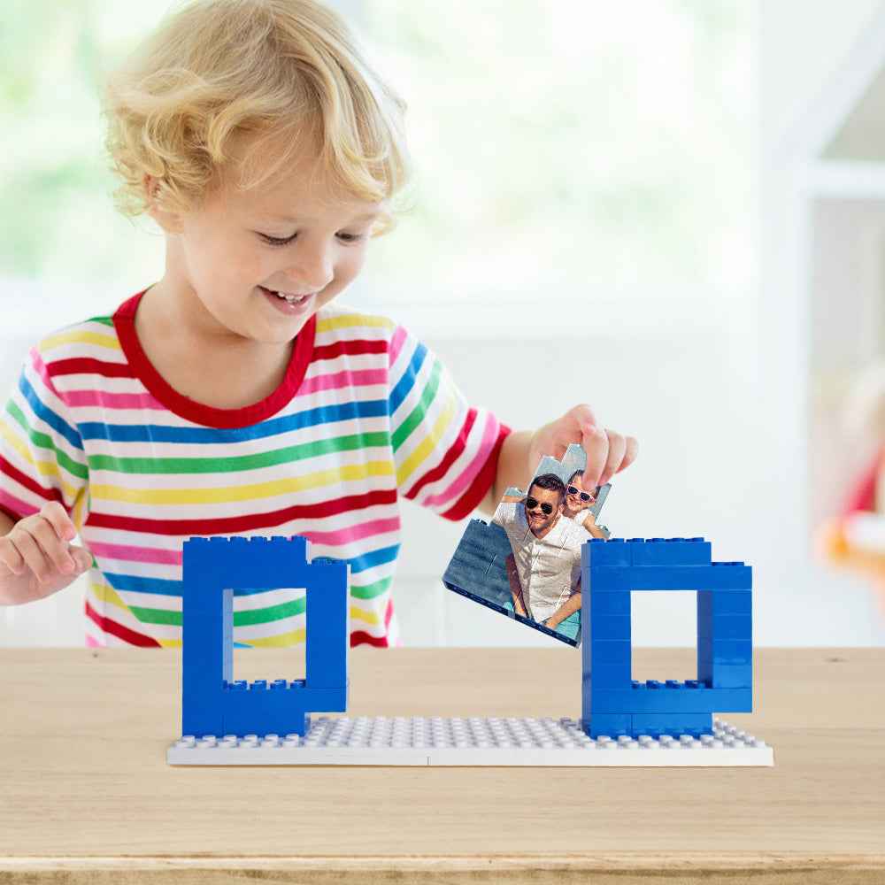 Child assembling a personalized dad photo puzzle featuring a father and child on blue puzzle holder