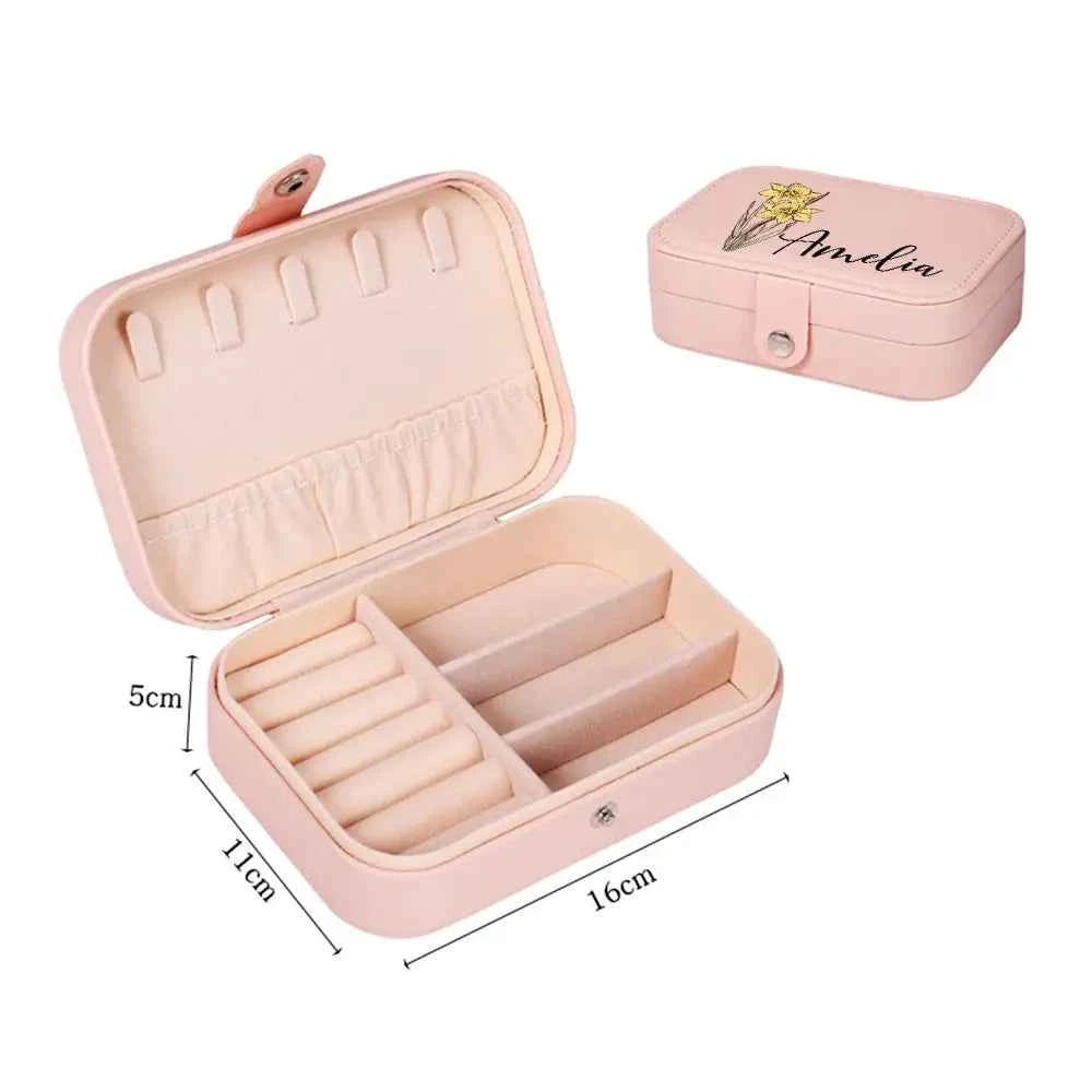 Pink personalised custom leather travel jewellery case with name and floral print open showing ring rolls and compartments
