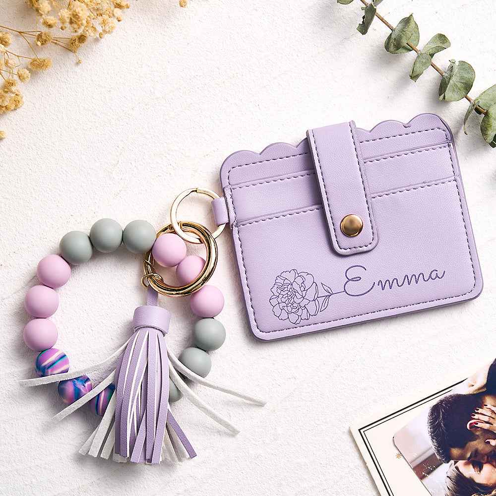 Lavender personalized birth flower wallet with floral design and name Emma featuring beaded keychain and tassel charm