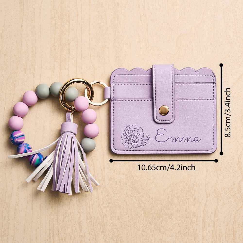 MadeMine personalized birth flower wallet in lavender with name Emma and beaded tassel keychain