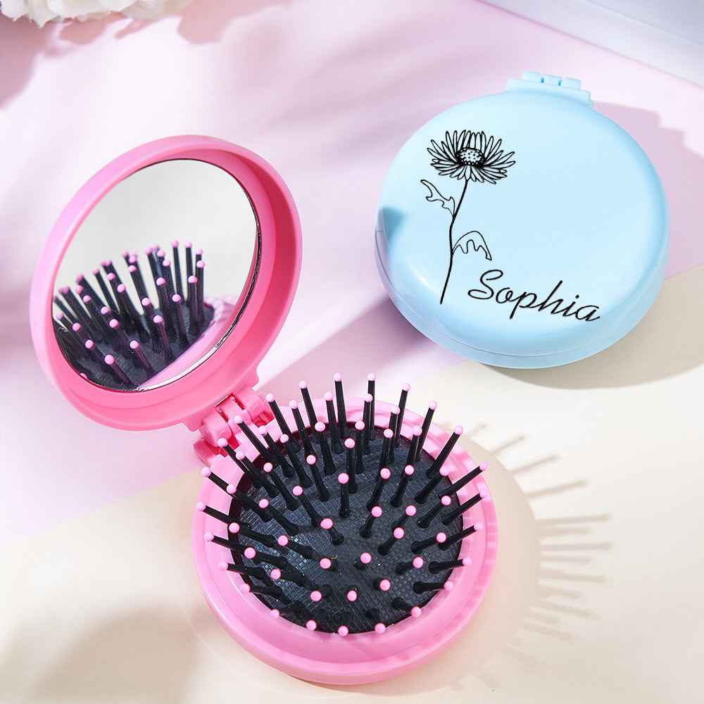 MadeMine personalized foldable mirror brush in pink with black bristles and a blue closed brush with flower and name Sophia