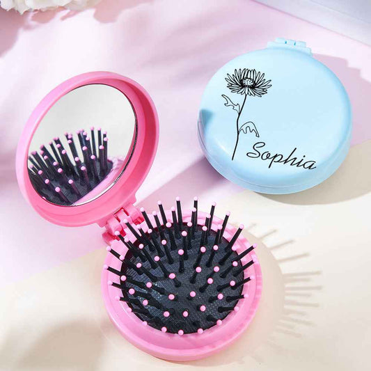 MadeMine personalized foldable mirror brush in pink with black bristles and a blue closed brush with flower and name Sophia