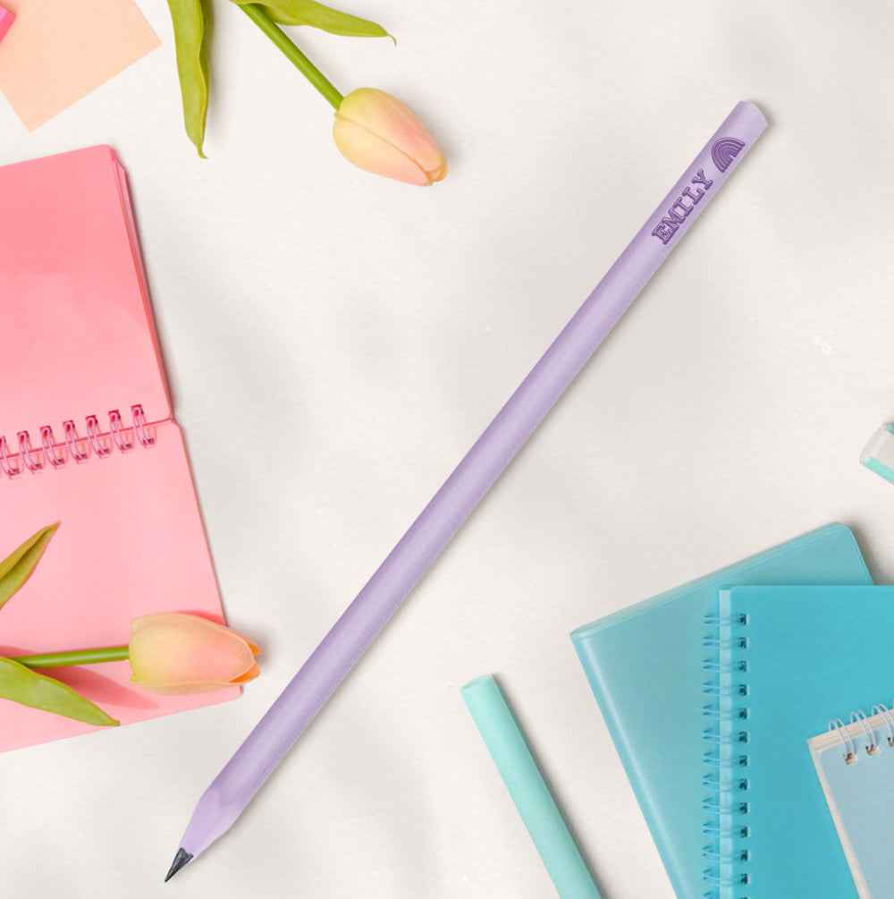 MadeMine lavender personalised pencils for school with printed name on pastel desk surrounded by notebooks and tulips