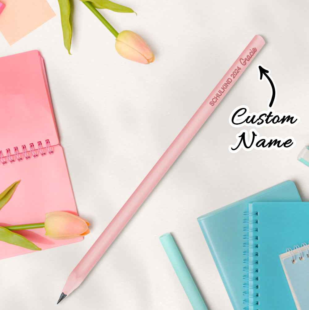 MadeMine pink personalised pencils for school with custom name printed diagonally next to pastel notebooks and tulips